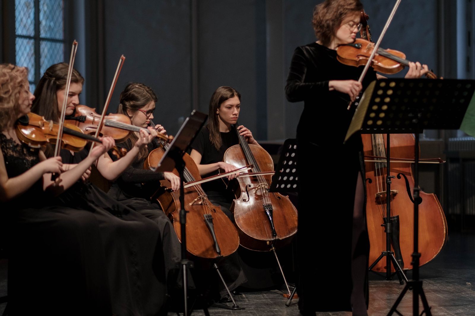 String ensemble playing classical music in a concert hall